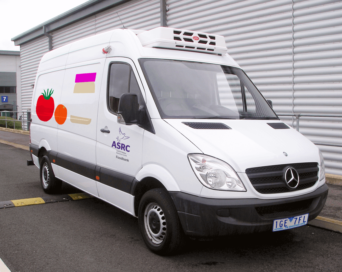 A van park in the street for ASRC Catering with illustrated food along the sides